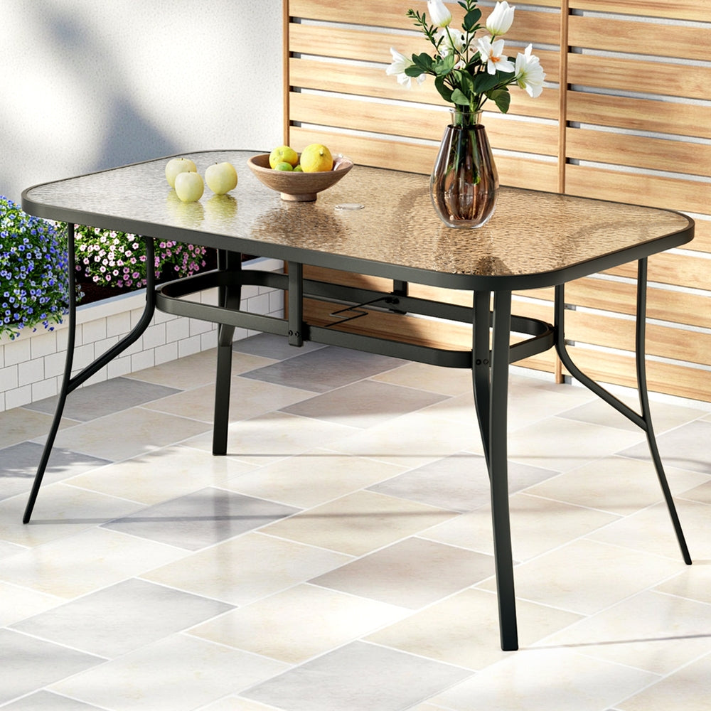 Gardeon 140CM Outdoor Dining Table Steel Frame Tempered Glass Parasol Hole Black